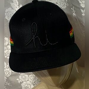 In4mation flat-brim cap”hi"embroidered. 
Red, yellow,& green stripes on the side